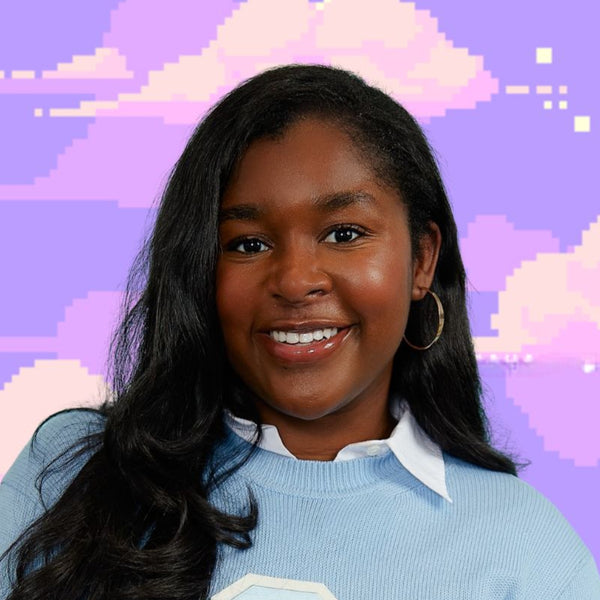 Cedoni Frances wearing a light blue sweater with a 'C' logo on a pastel cloud background